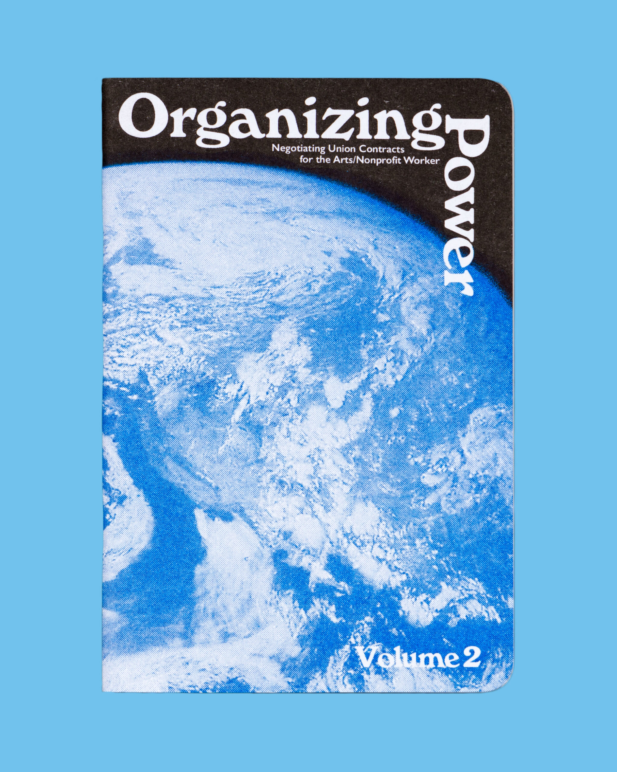 Cover of Organizing Power, Volume 2: Negotiating Union Contracts for the Arts/Nonprofit Worker, featuring a blue-and-white satellite image of Earth beneath a black title band.